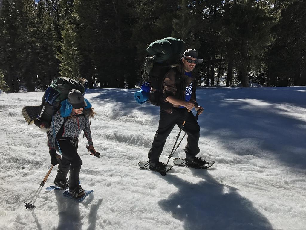 Leaders Brian and Cynthia on snowshoes heading home